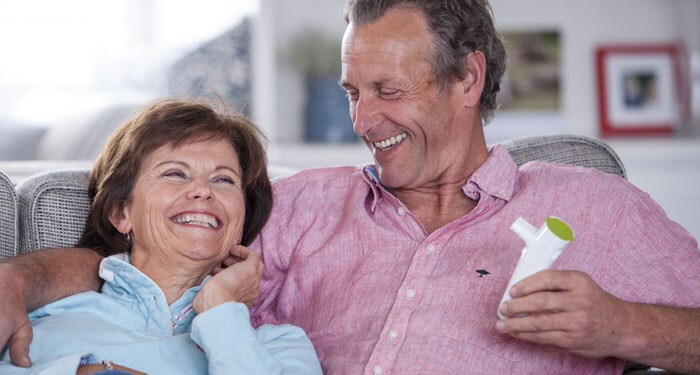 Laughing gentleman enjoying the benefits of the InnoSpire Deluxe and SideStream nebulizer